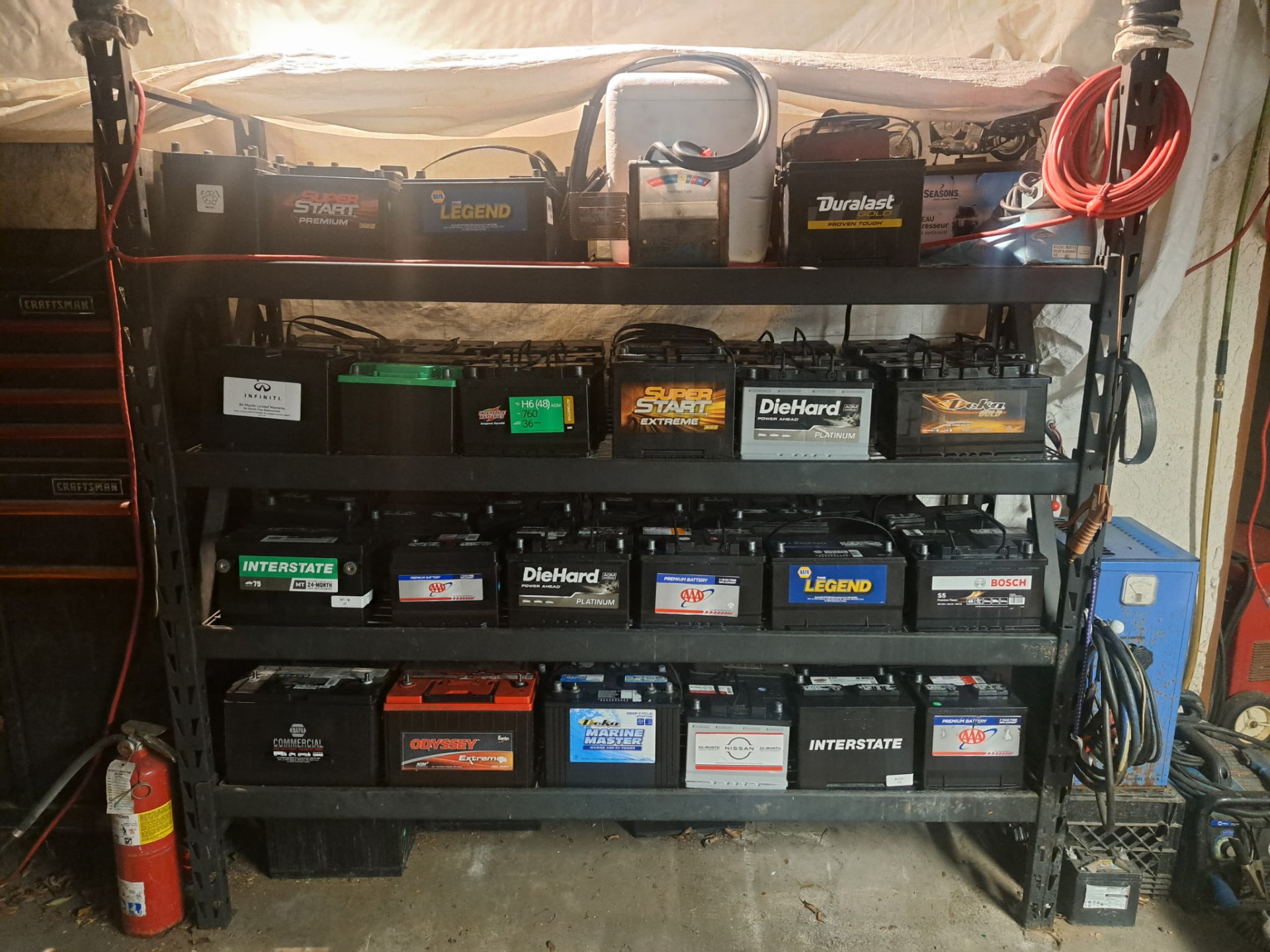 Shelves stocked with new car, truck, RV and marine batteries at The Battery Man Auto/AC.